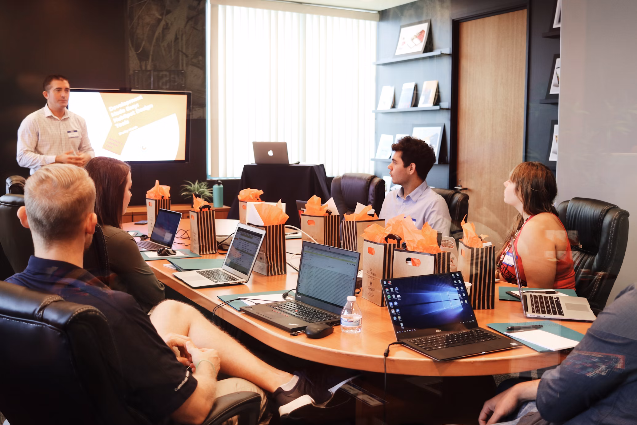 IT Launch Solutions team meeting discussing technology solutions for business clients